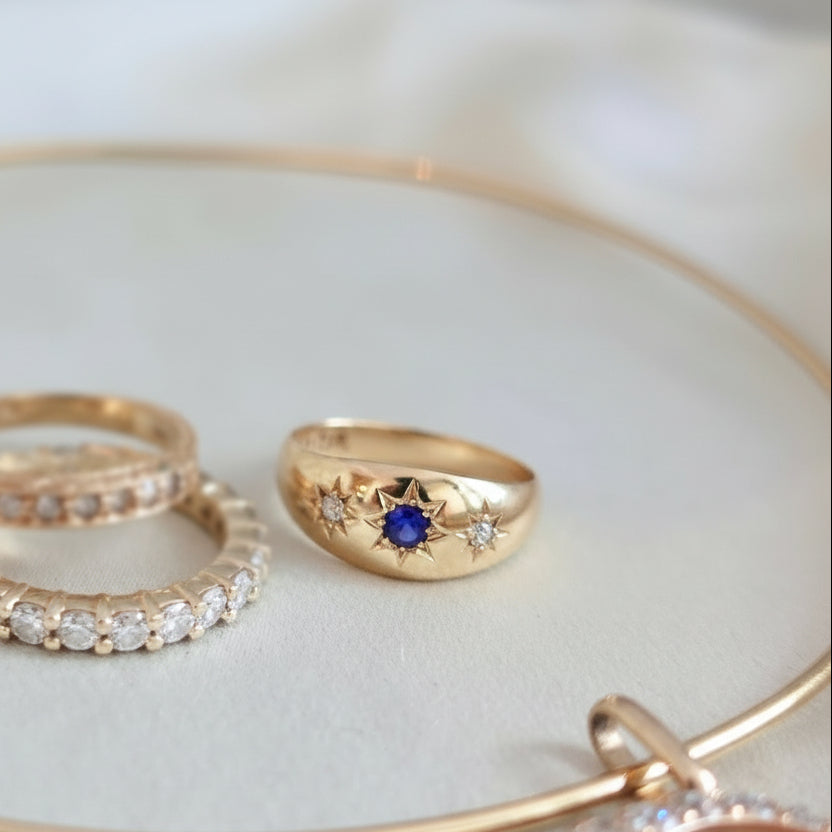 British Sapphire Three-Stone Ring with Diamond Accents